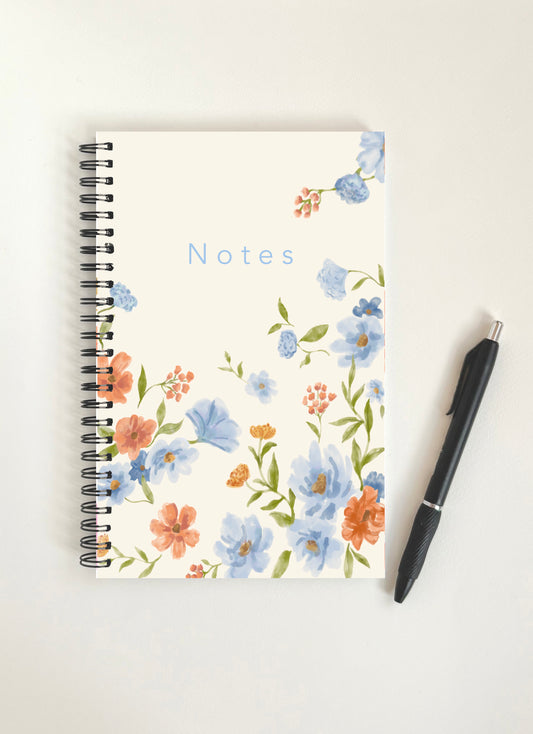 Blue and orange floral notebook